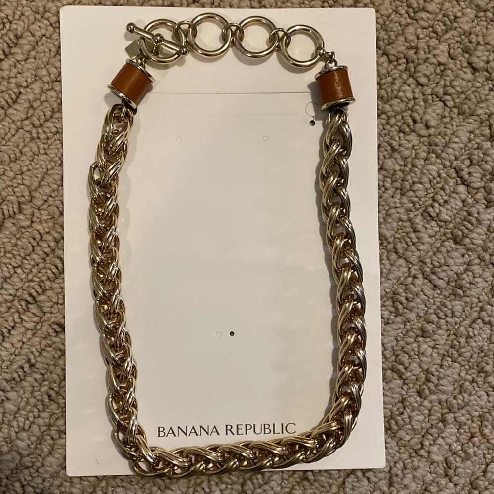 BR beautiful fashion gold chunky necklace with brown leather accents.